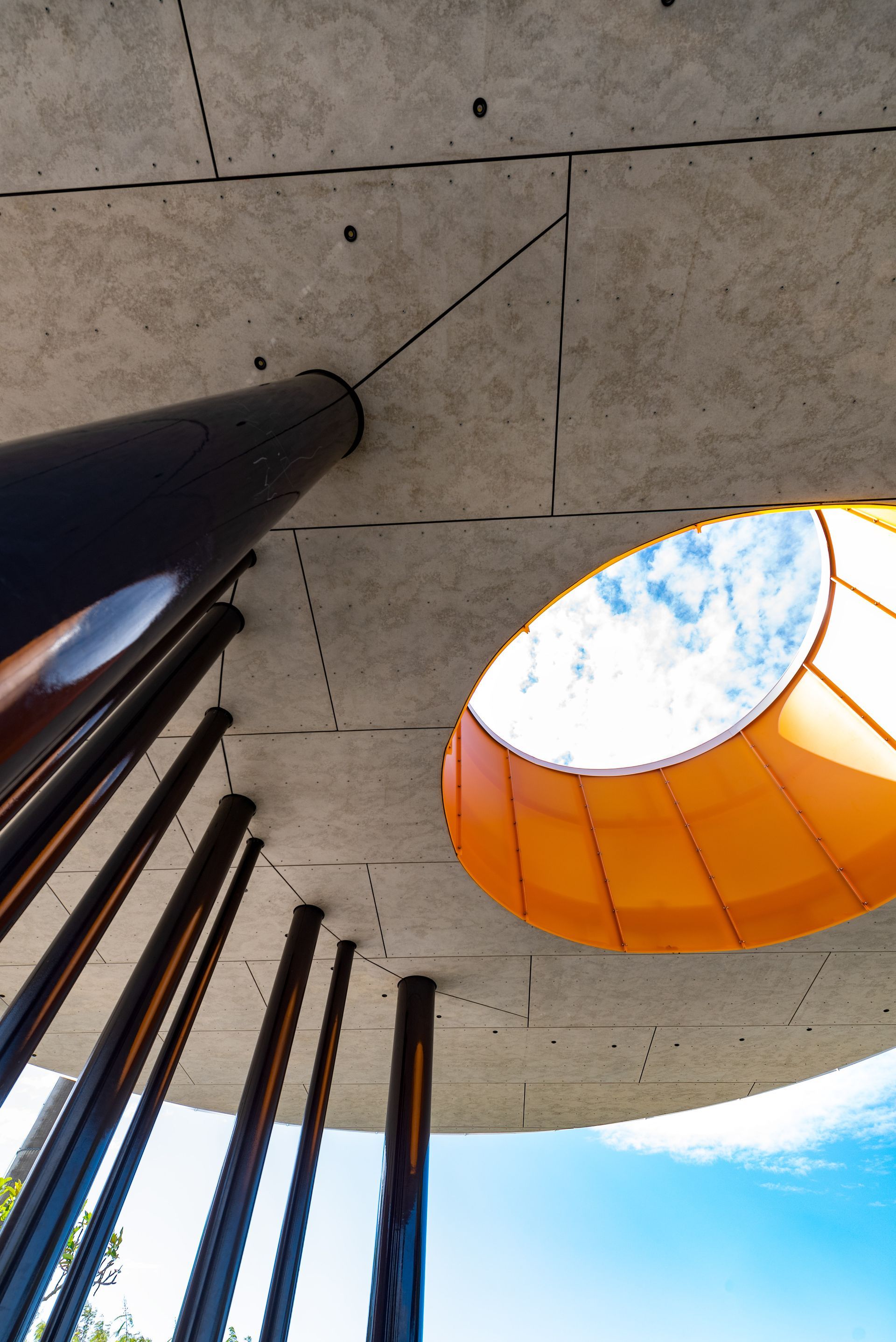 Looking Up at a Concrete Circular Structure With Black Support Beams — BOLD Architecture + Interior Design In Mackay, QLD