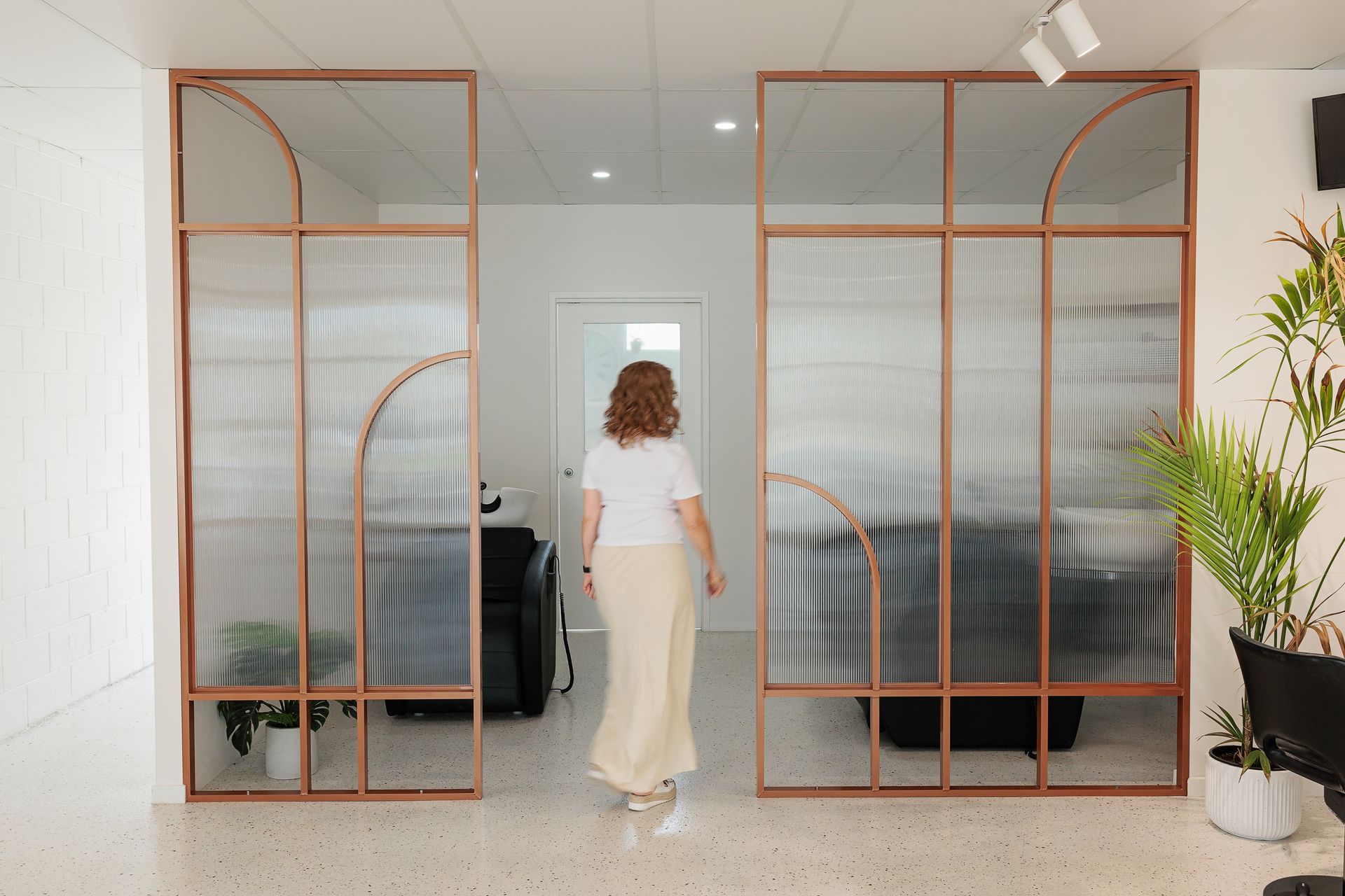 Woman Walking Through a Modern Office — BOLD Architecture + Interior Design In Mackay, QLD