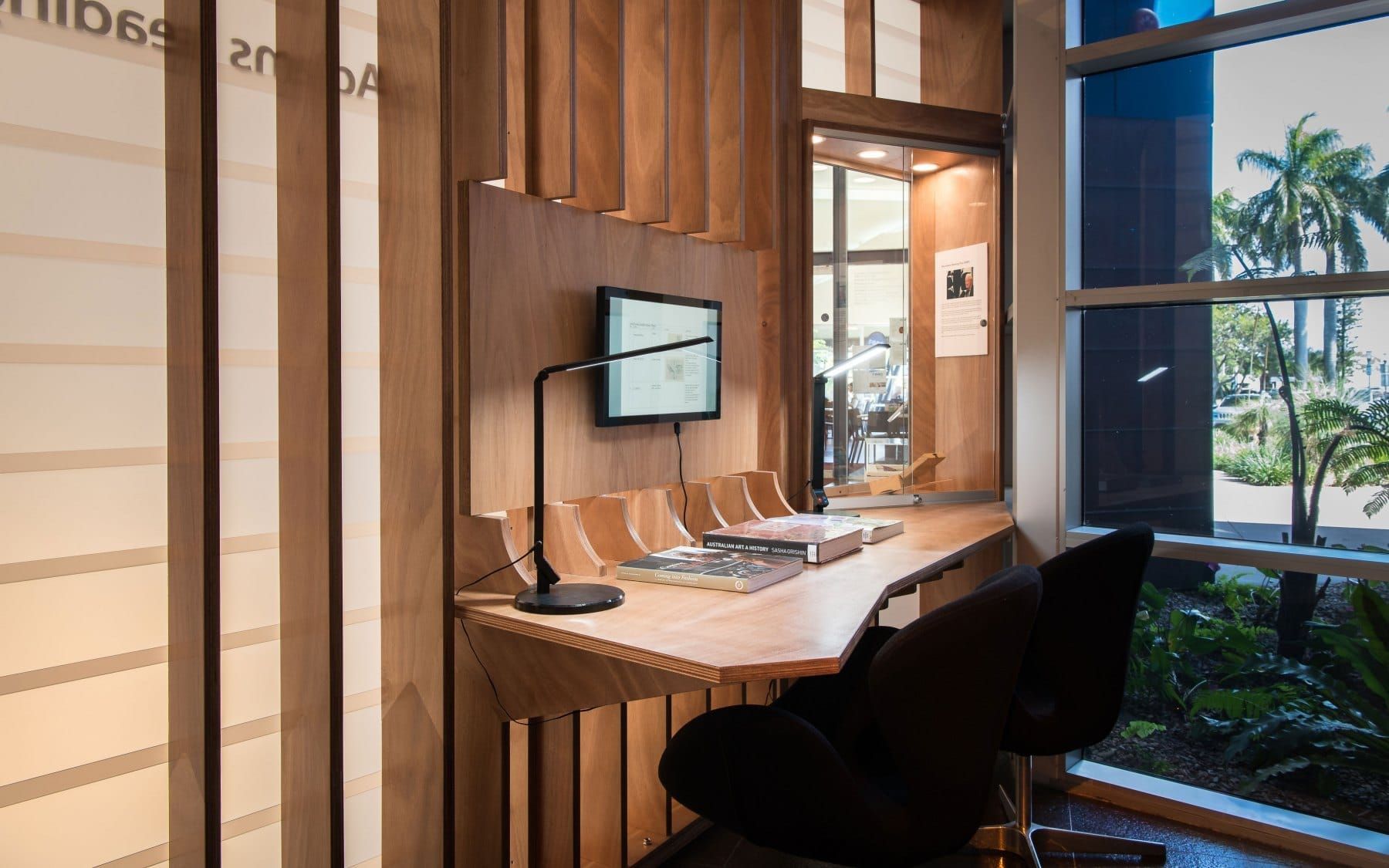 Cozy Wooden Workstation With Computer, Chair, and Window Overlooking Palm Trees — BOLD Architecture + Interior Design In Mackay, QLD
