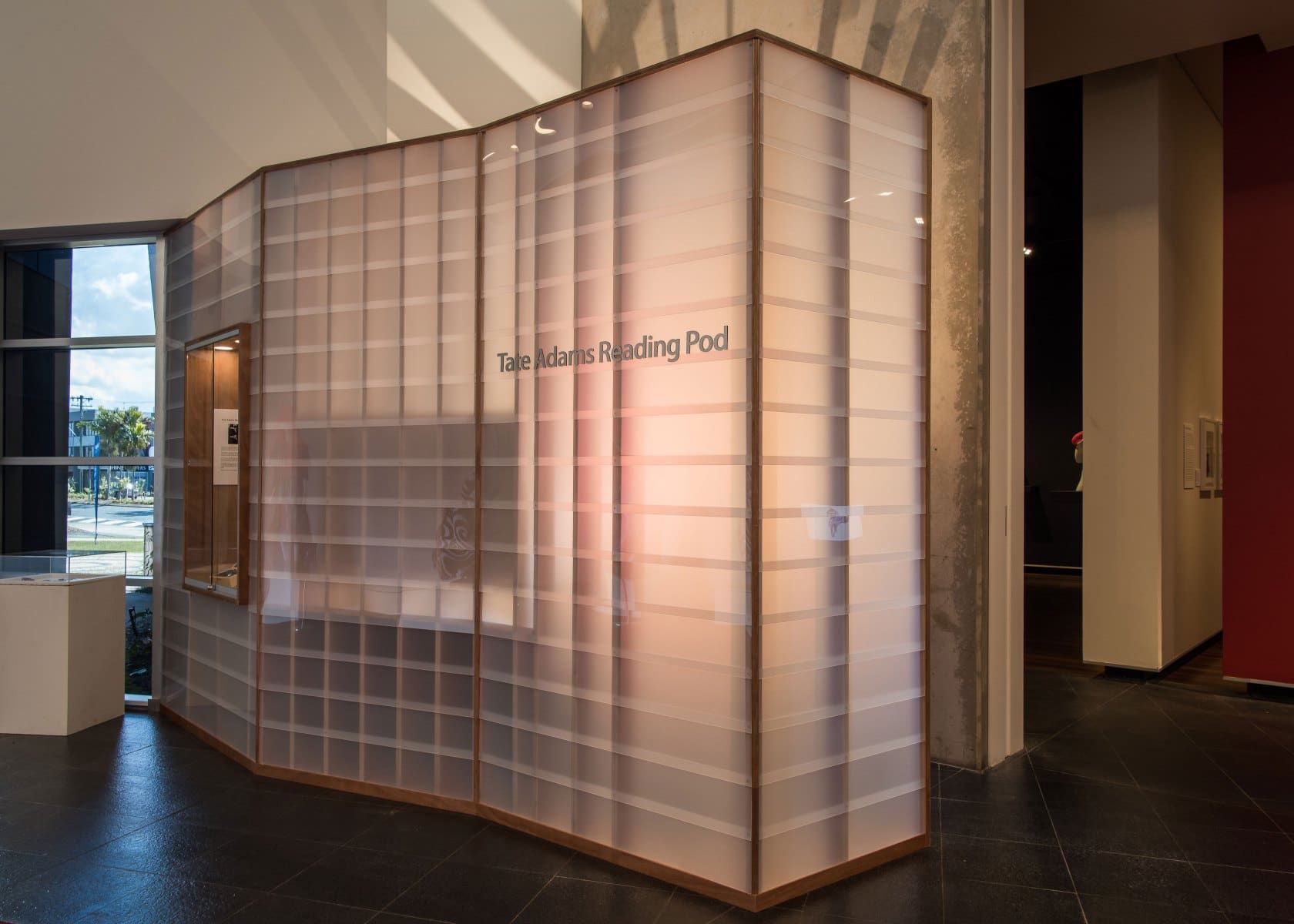 A Curved Wall of Frosted Glass Blocks in an Art Gallery, Labeled The James Reading Pad — BOLD Architecture + Interior Design In Mackay, QLD