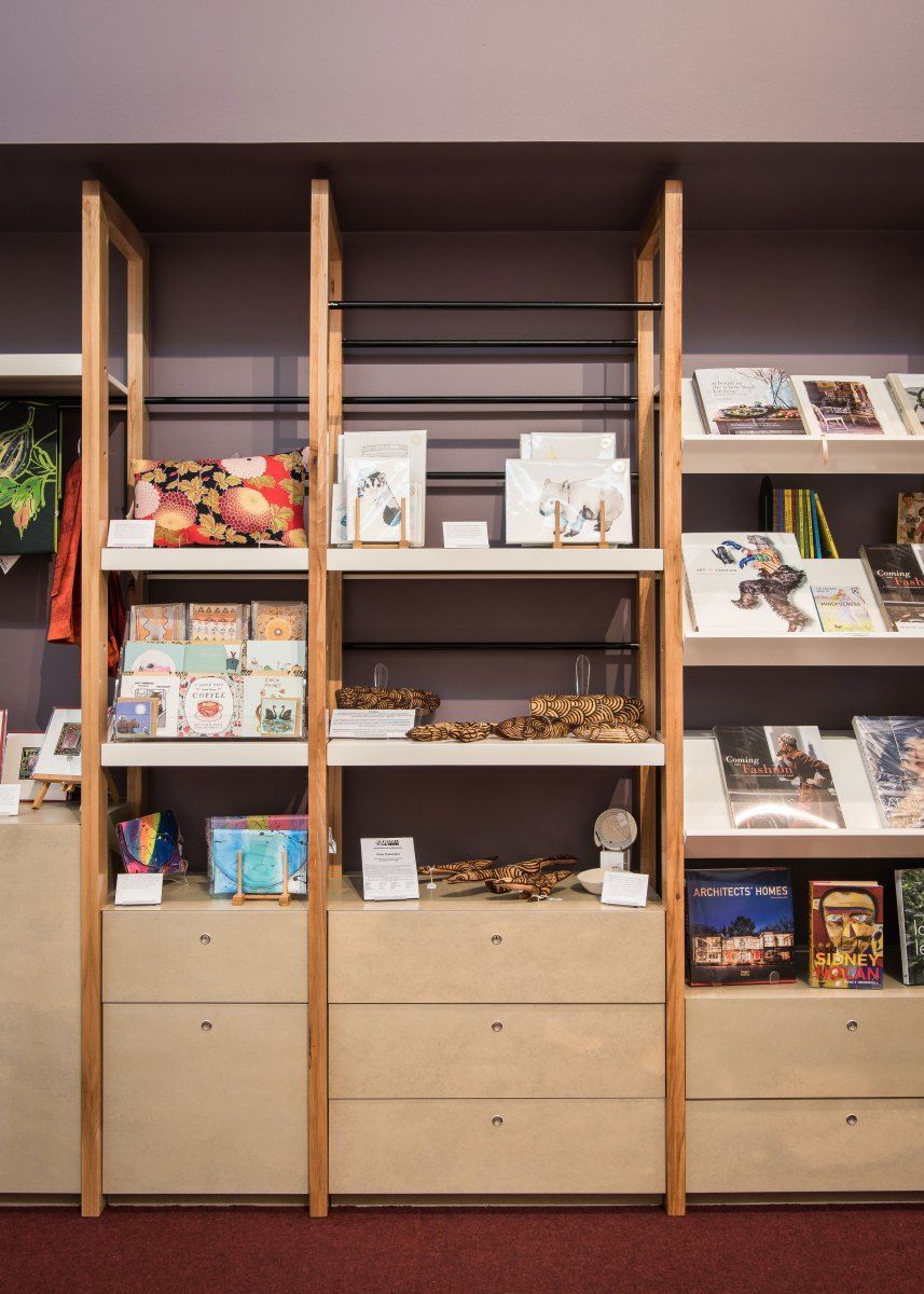 Shelves Displaying Items Like Books and Jewelry in a Shop, With a Light-colored Wooden Frame — BOLD Architecture + Interior Design In Mackay, QLD
