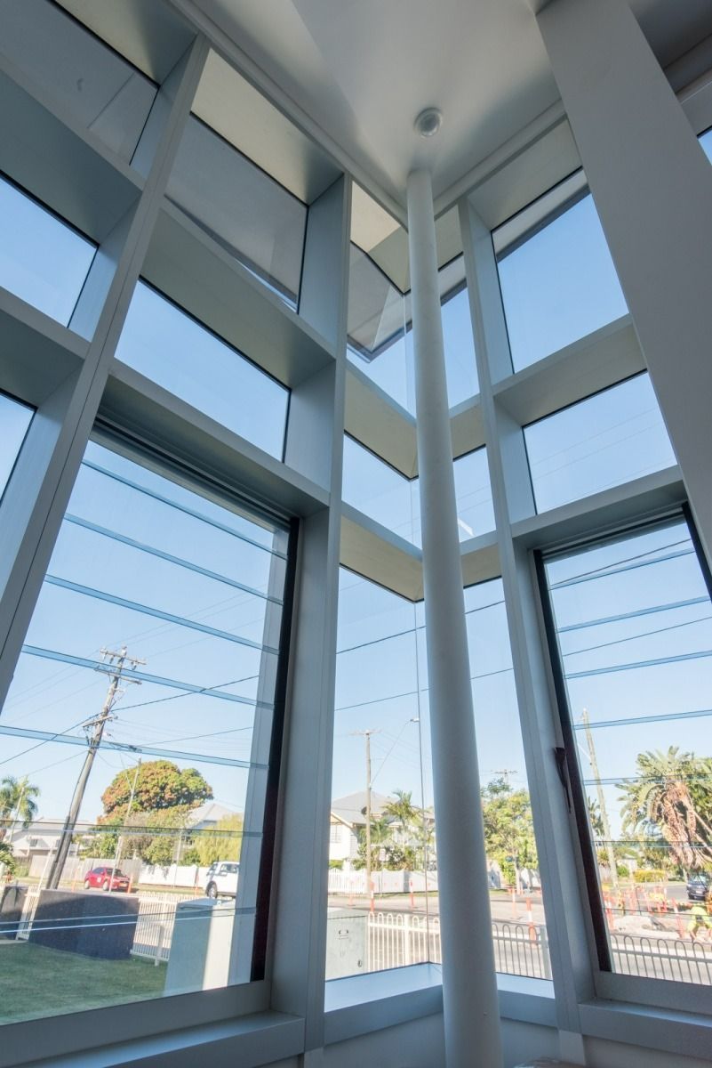 Interior View of A Building with Large Windows and A Central White — BOLD Architecture + Interior Design In Mackay, QLD