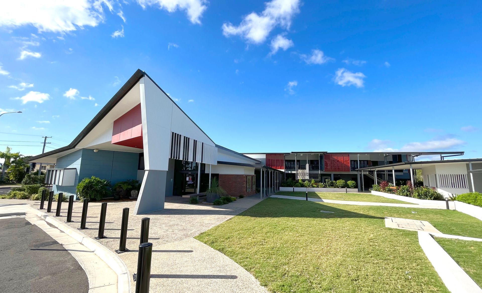 Modern Building With Blue, White, and Red Accents, Angled Roof — BOLD Architecture + Interior Design In Mackay, QLD