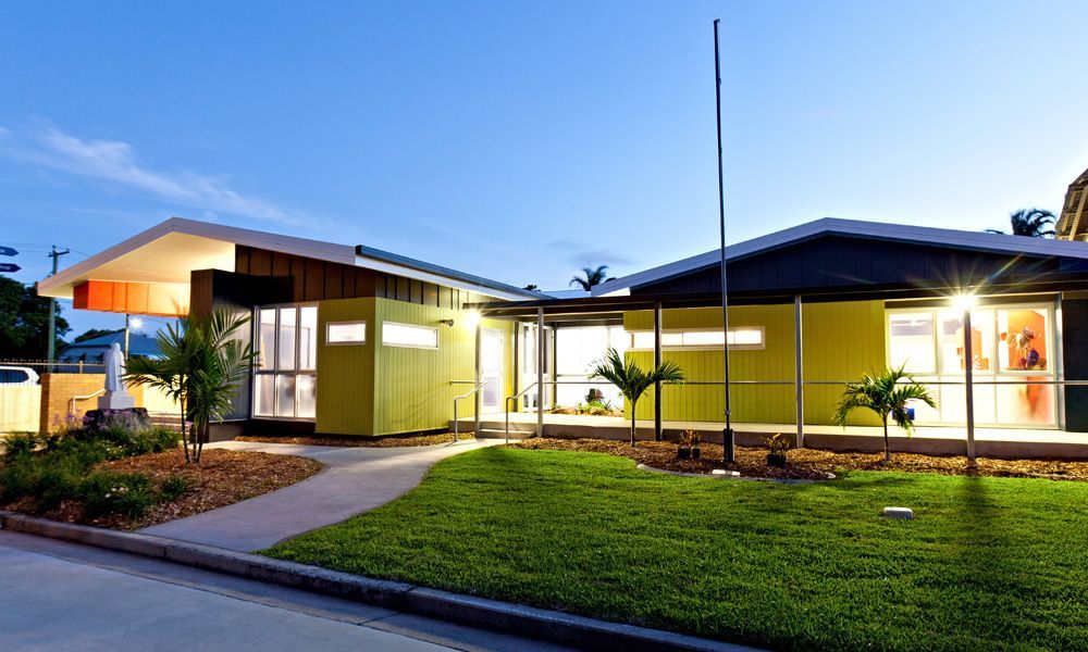 Modern, Lime Green Building With Contrasting Orange and Dark Roof, Bright Windows — BOLD Architecture + Interior Design In Mackay, QLD