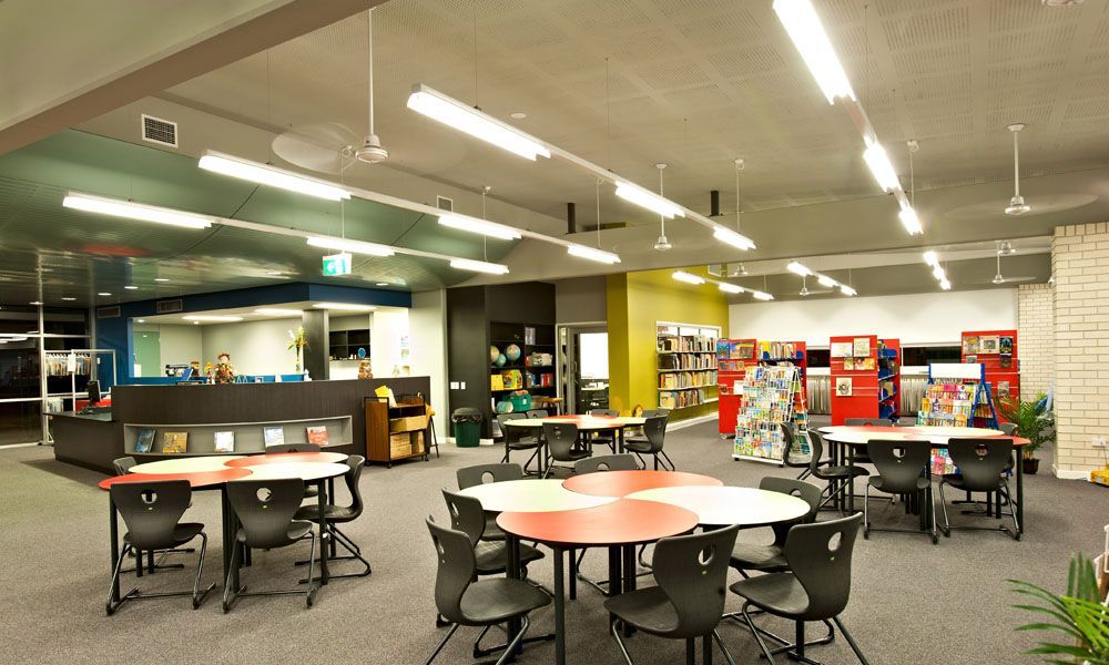 Interior of a Library With Tables, Chairs, and Books — BOLD Architecture + Interior Design In Mackay, QLD