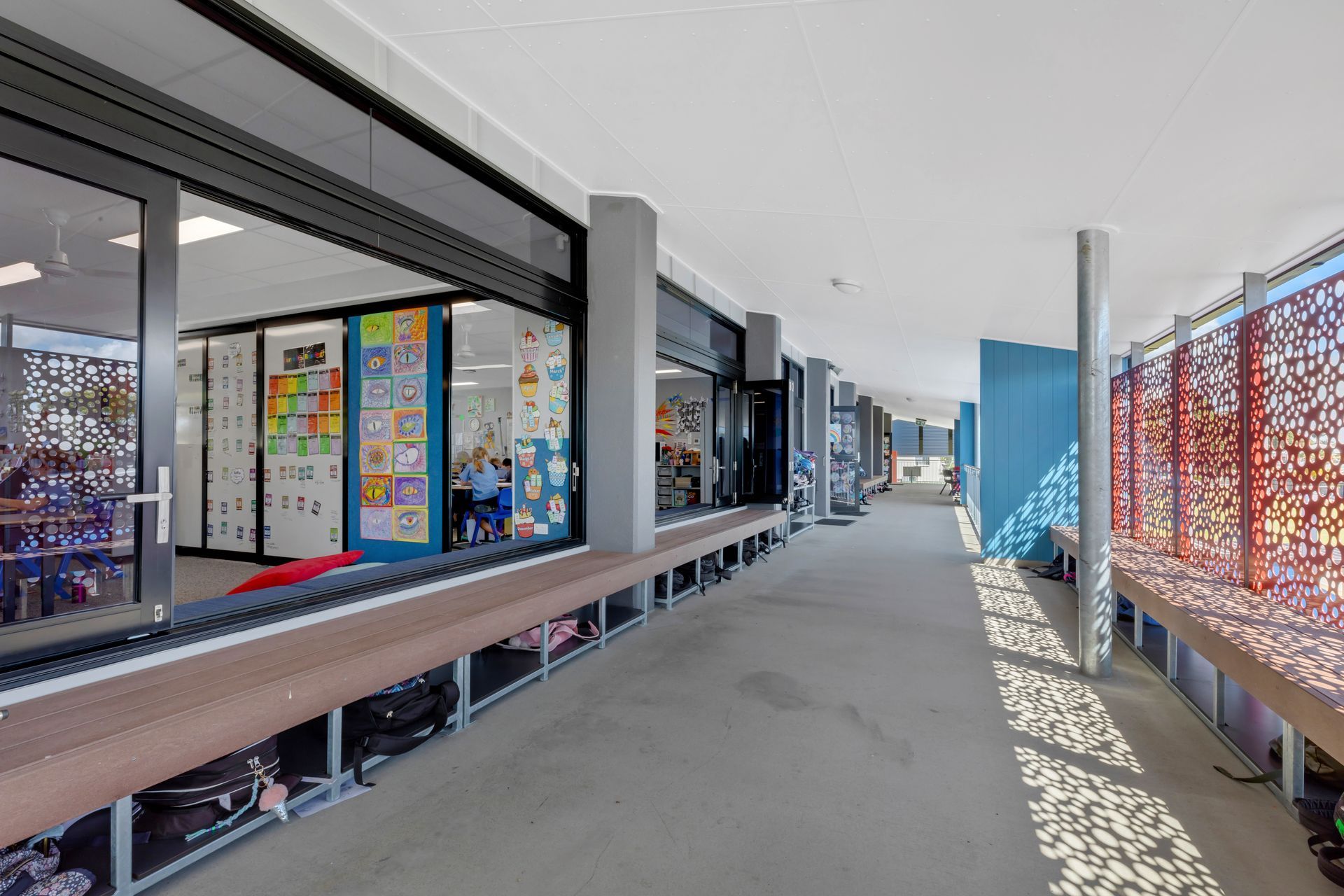 Long Hallway With Benches, Classrooms Visible Through Glass Doors — BOLD Architecture + Interior Design In Mackay, QLD