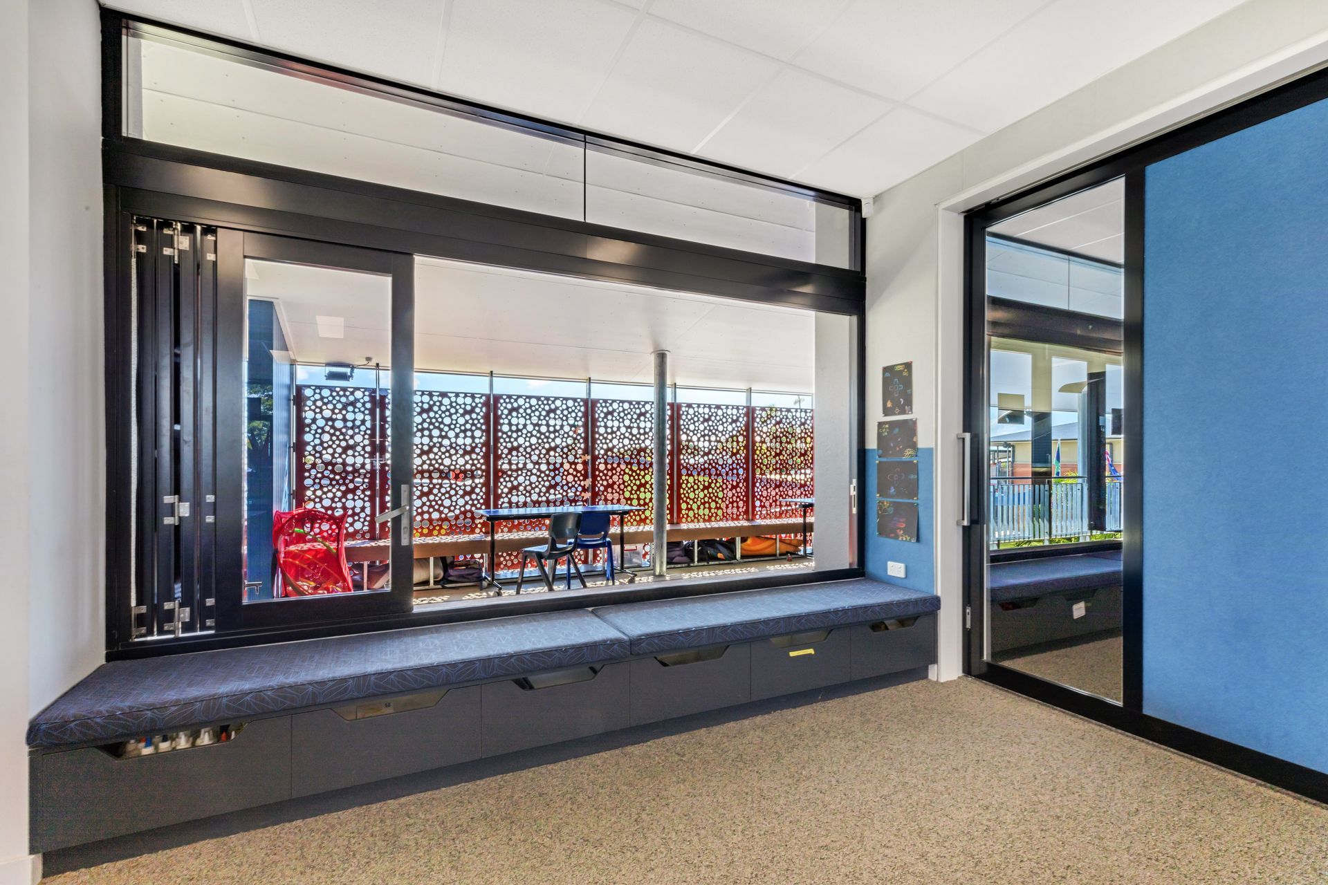 A Built-in Window Seat in a Hallway Overlooks an Outdoor — BOLD Architecture + Interior Design In Mackay, QLD