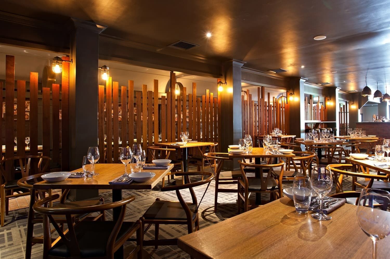Restaurant Interior with Wooden Furniture — BOLD Architecture + Interior Design In Mackay, QLD