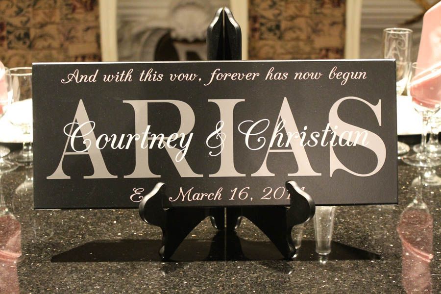 Black sign with white text. It reads 