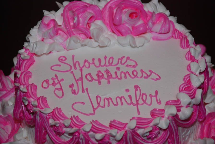 Pink and white frosted cake with 