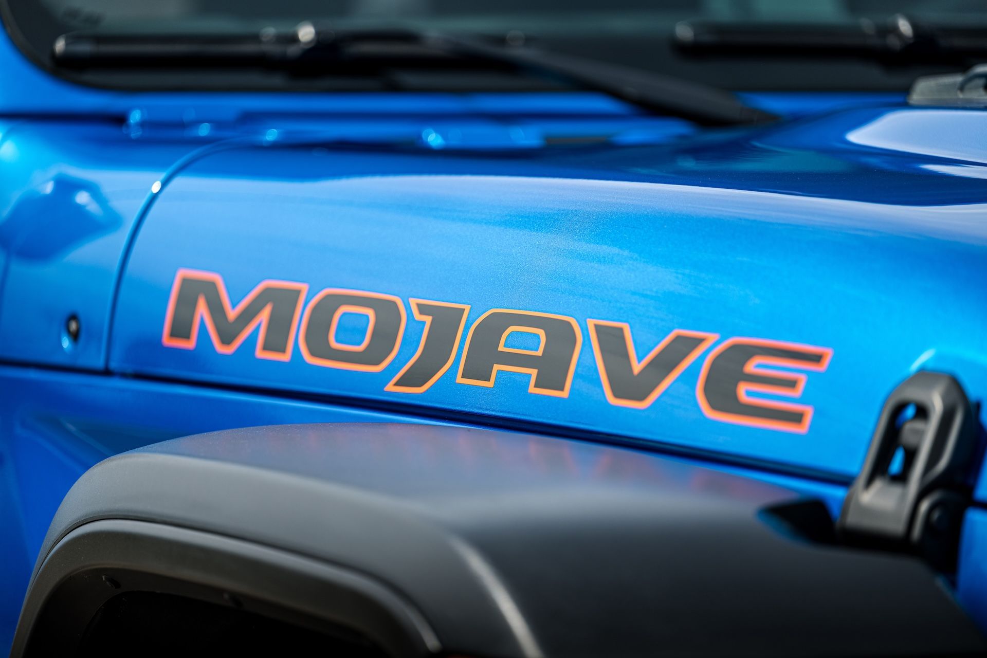 A blue jeep with the word mojave on the hood