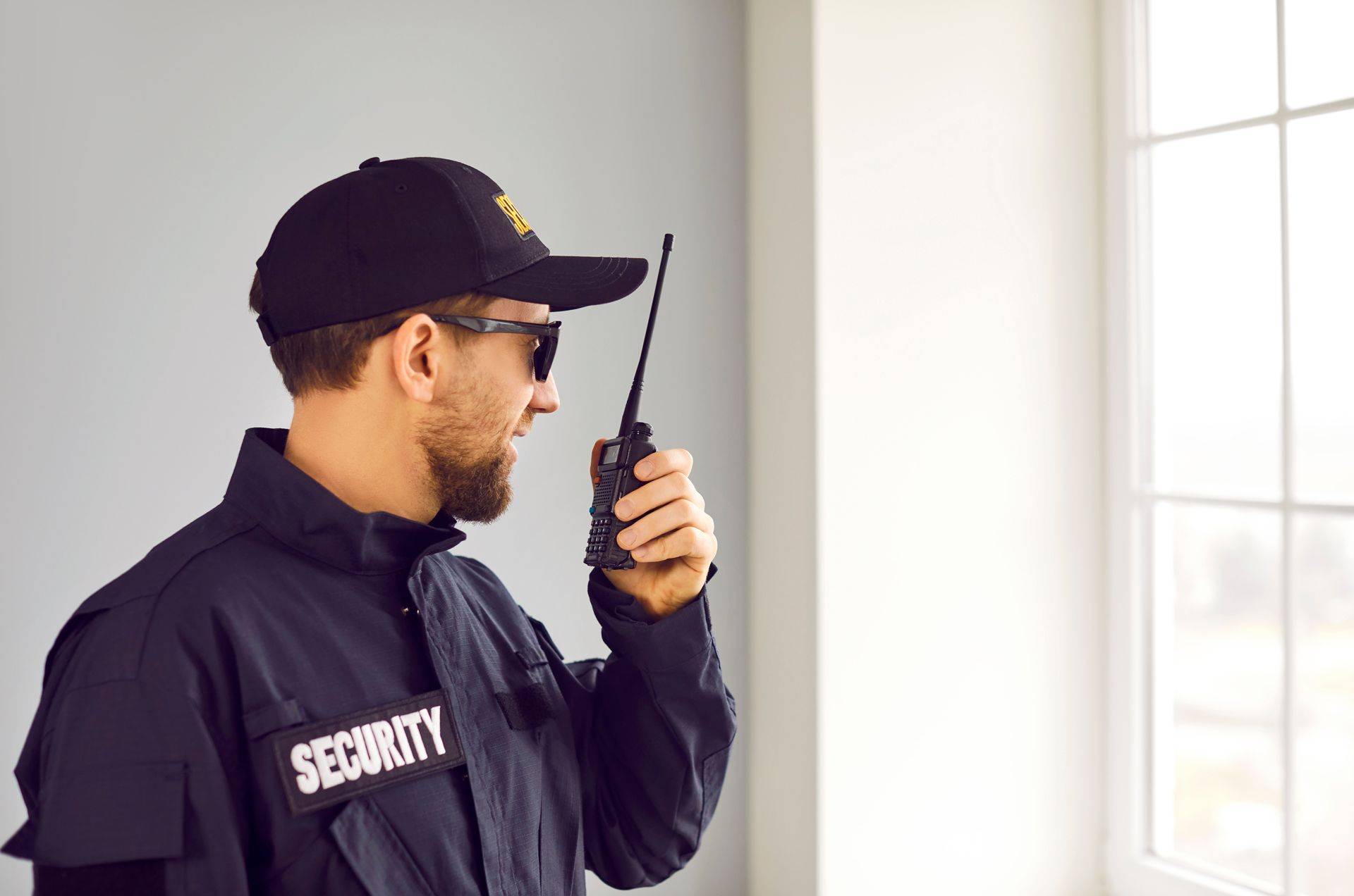 Security Guard Talking to Walkie Talkie