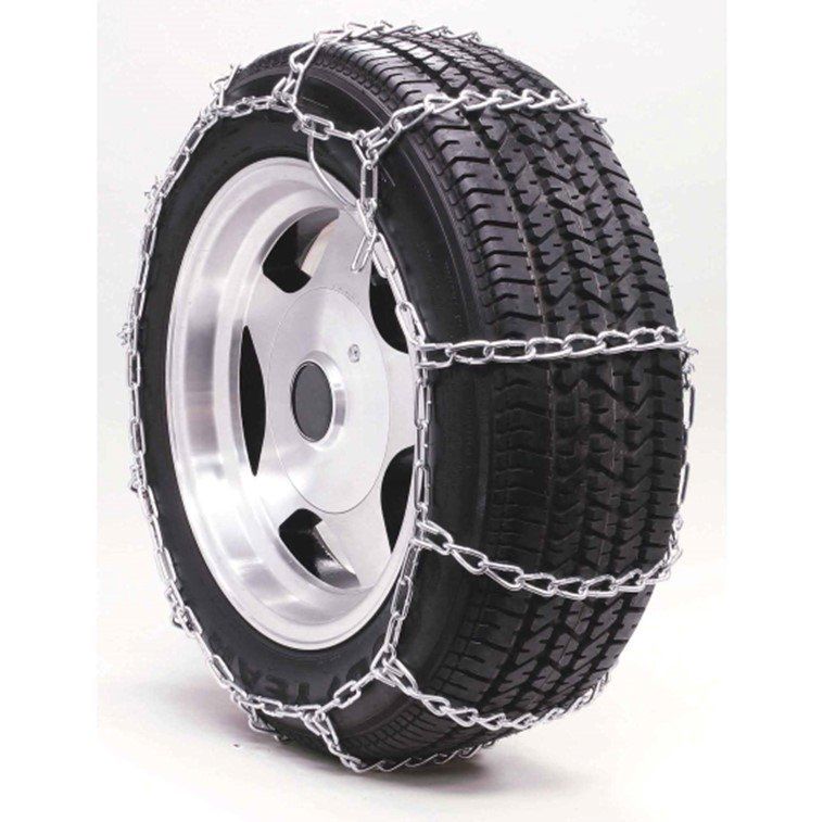Tire with snow chains, silver chains wrapped around a black tire on a silver wheel.