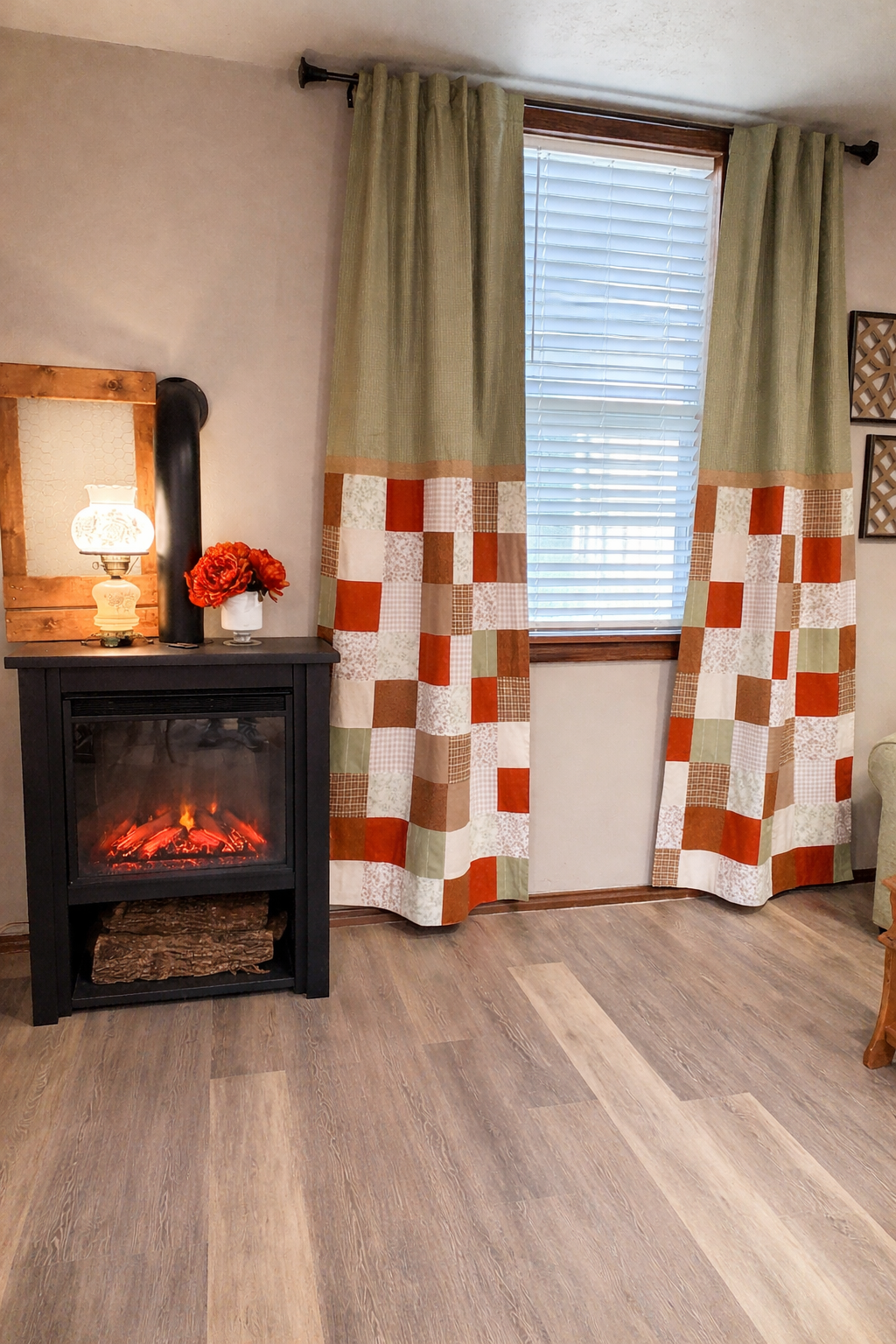 Cozy living room corner with electric fireplace, lamp, window, and patterned curtains