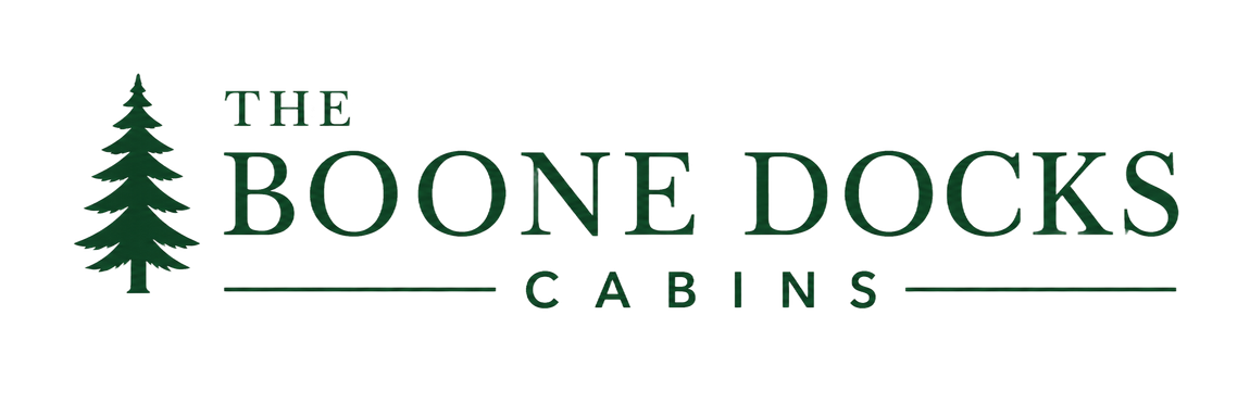 The Boone Docks Cabins logo with a green pine tree and serif text on a white background