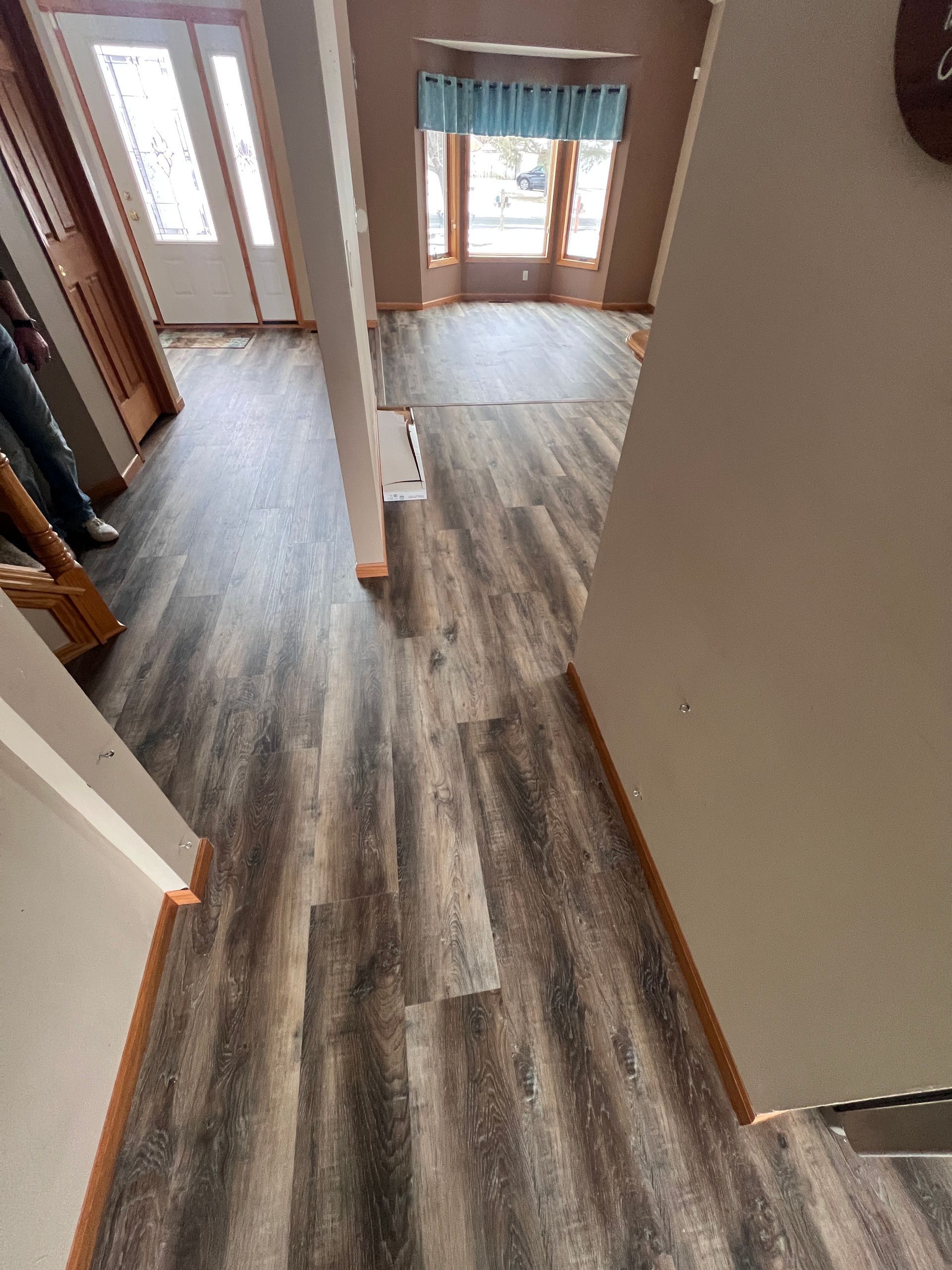 Luxury Vinyl Clean laminate floor install in Forest Lake living room