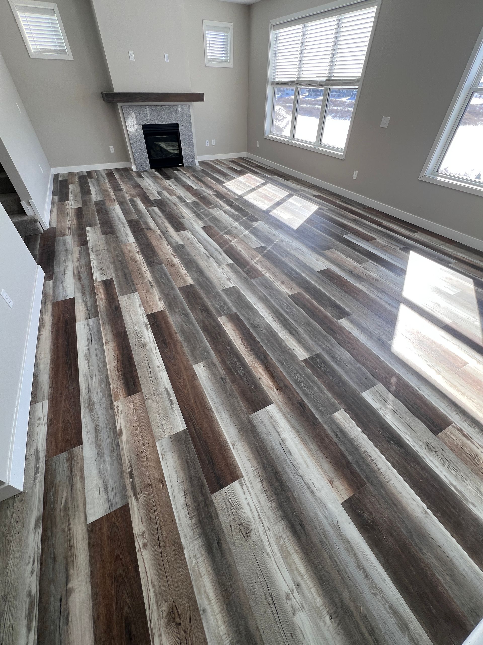 Gray LVP flooring installed in Woodbury MN living room
