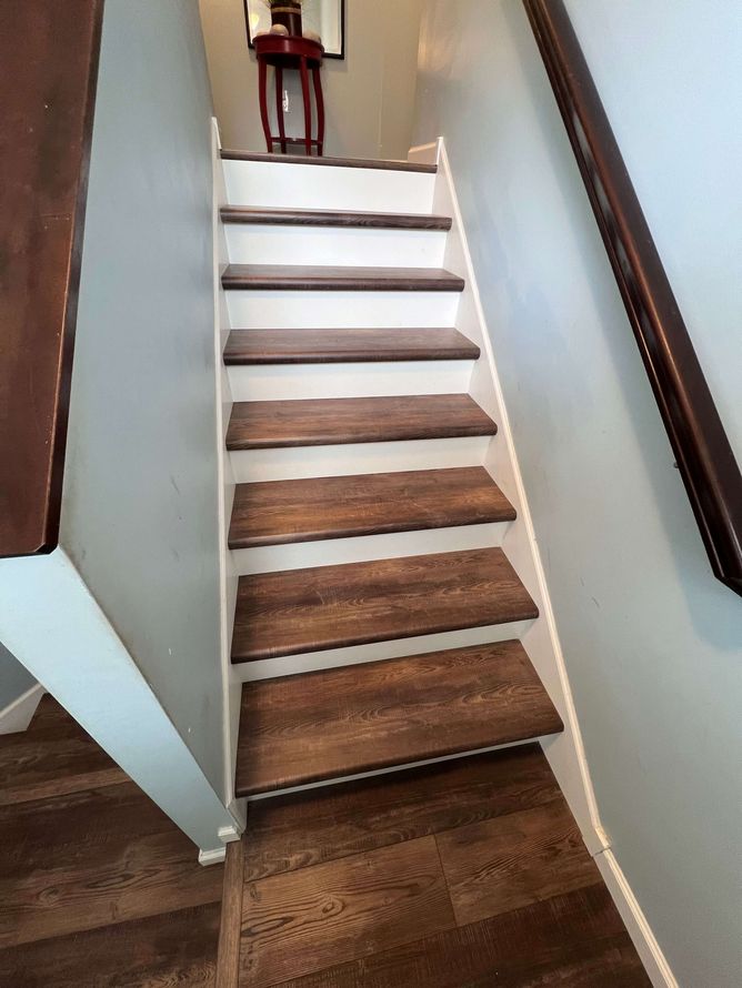 Staircase finished with wood-look treads and contrasting risers