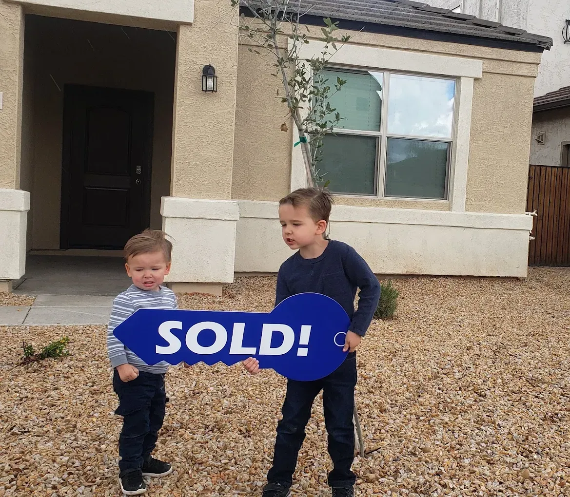 Two children celebrating a new home purchase in Florence, Arizona