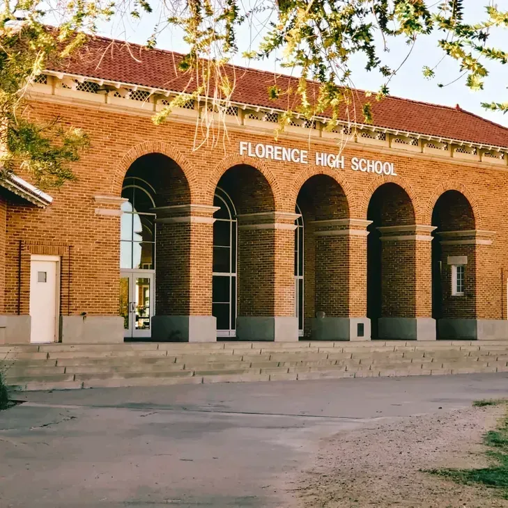 Florence High School brick entrance with arched columns and red roof