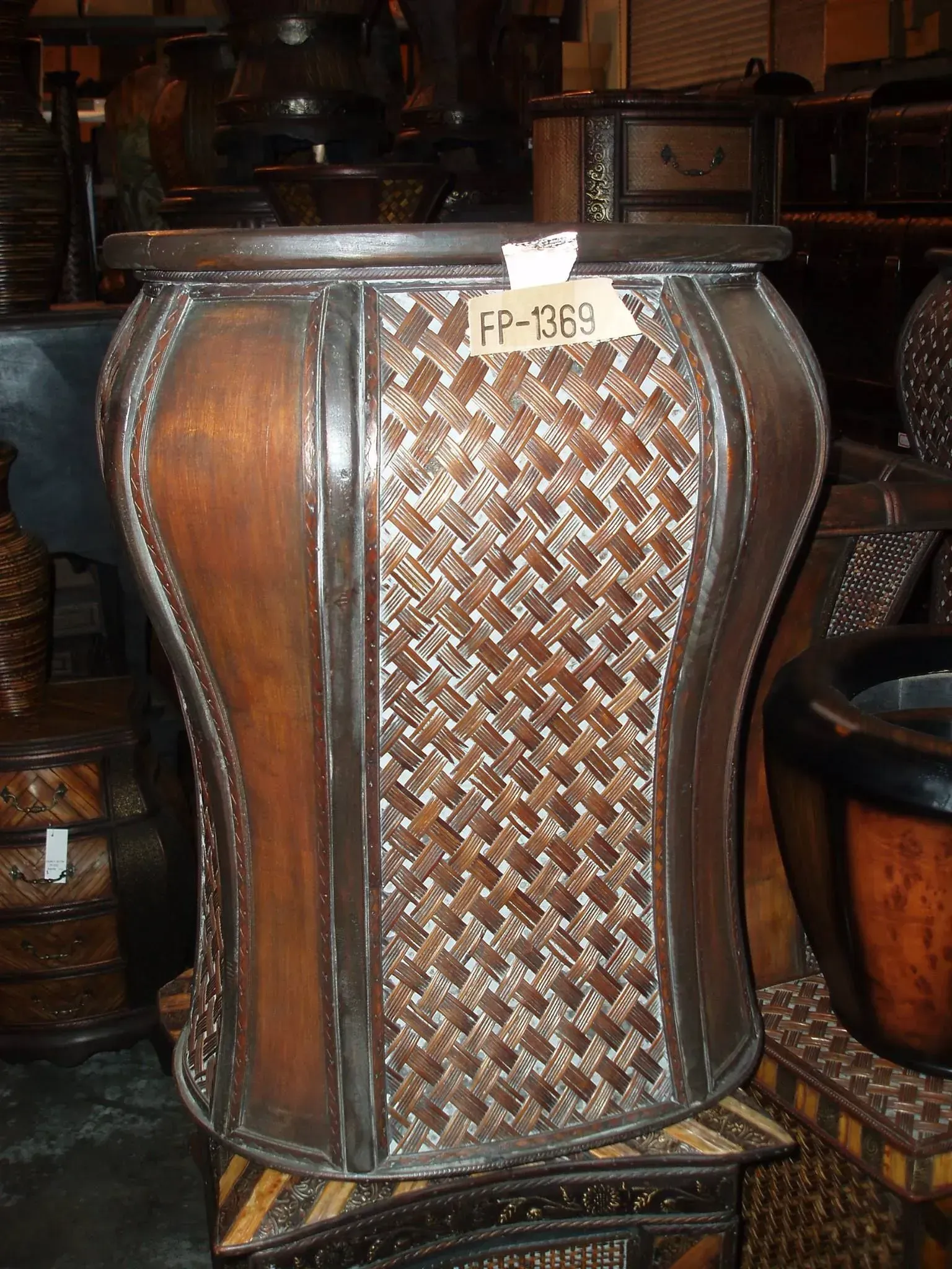 Brown wooden storage container with woven panels.