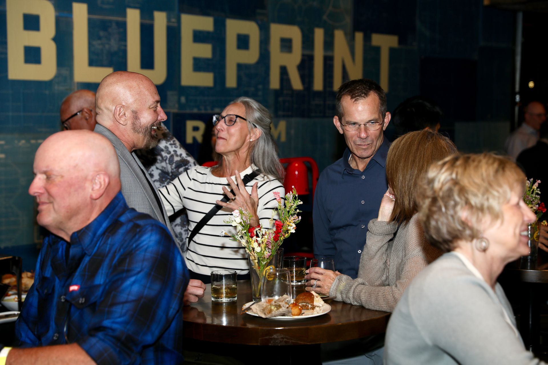 People at an event, interacting near a 
