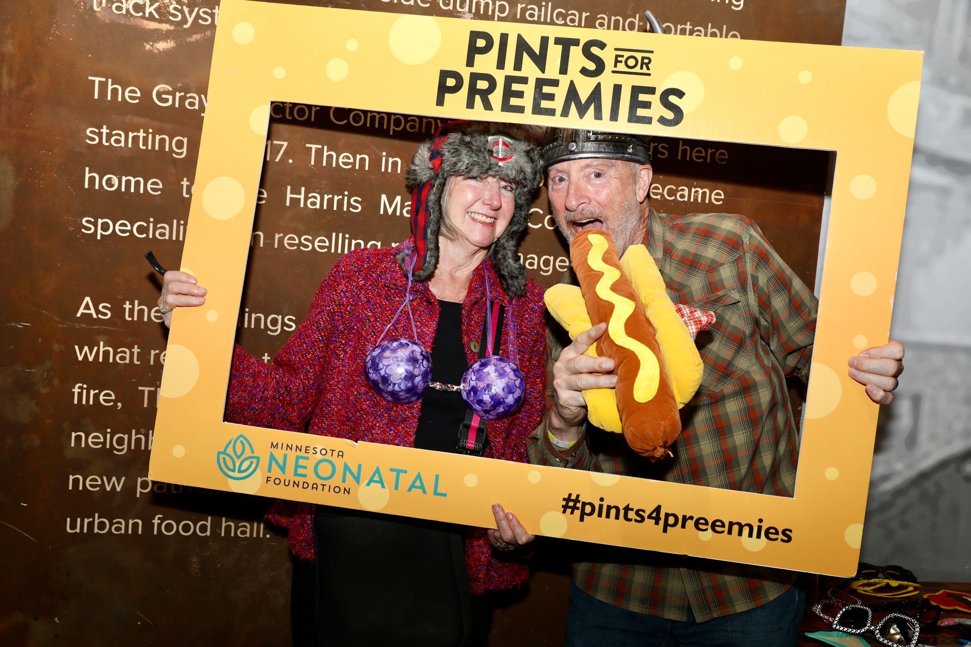 Two people holding a 