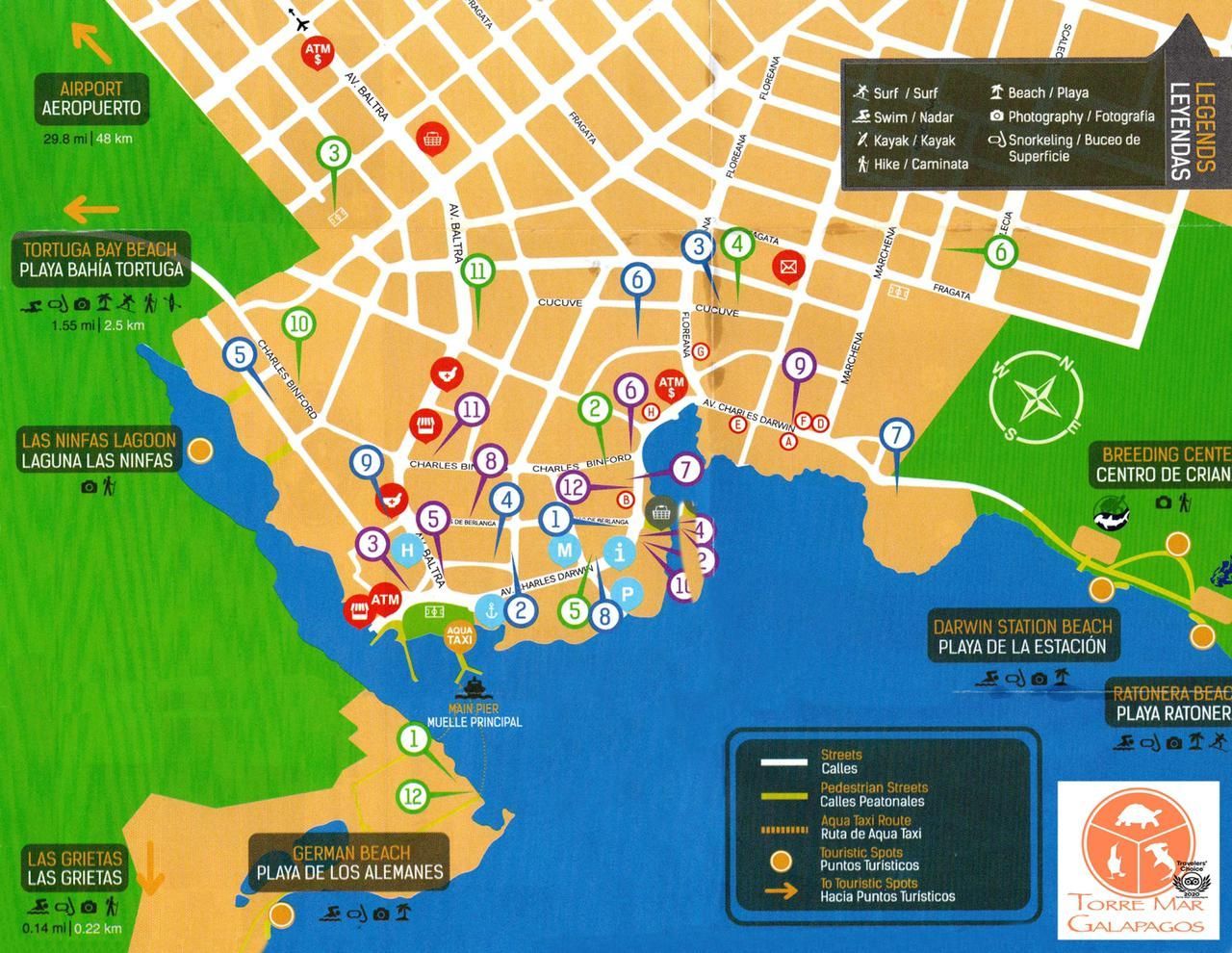 Color-coded map with many markers and labels of Puerto Ayora along the coast