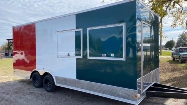 Food trailer with red, white, and green exterior. Two serving windows. Trailer is parked outdoors.