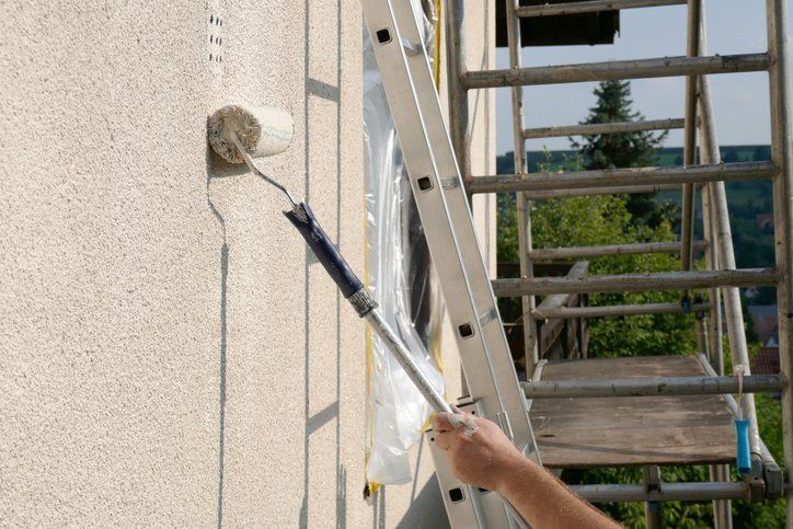 Painting walls.Repair and construction concept
