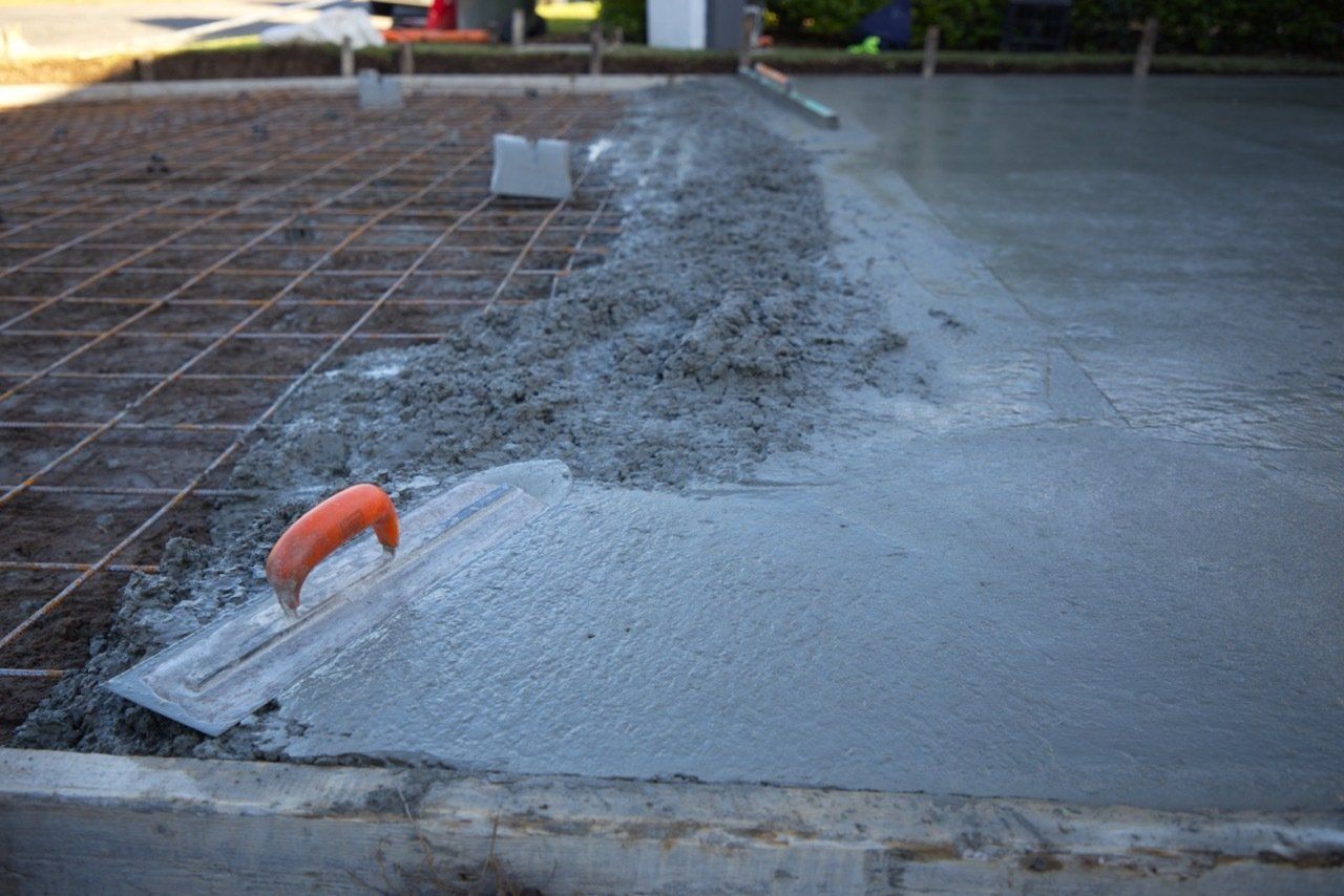 Fresh Concrete Being Smoothed With a Trowel — Easy Mix Concrete In Berkeley Vale, NSW