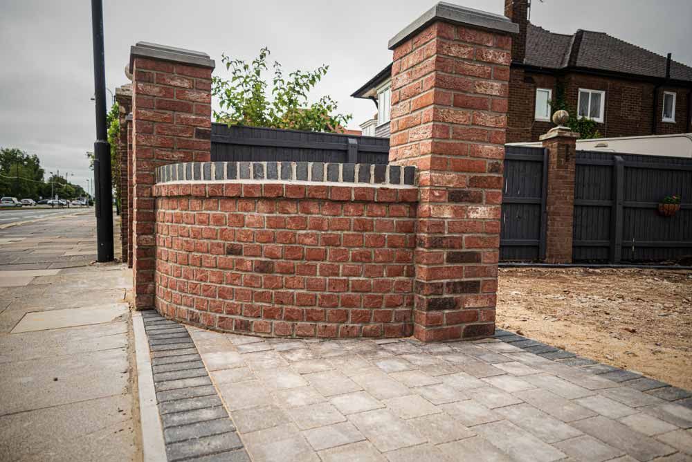 Brick Wall With Pillars and Curved Section — Easy Mix Concrete In Wyong, NSW