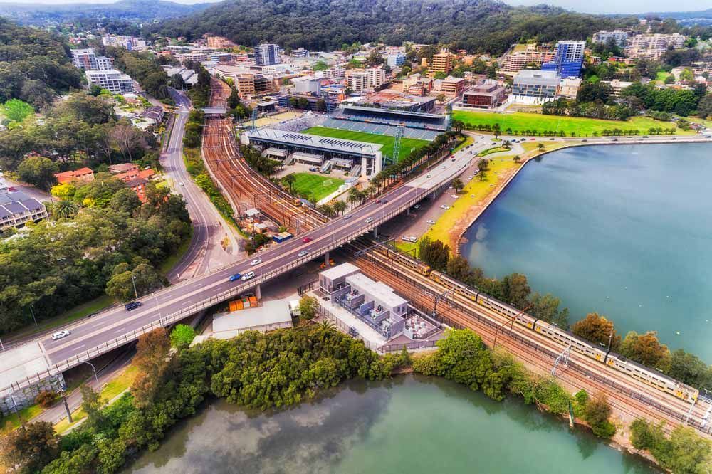 Aerial View of a City With Bridges, Train Tracks — Easy Mix Concrete In Gosford, NSW