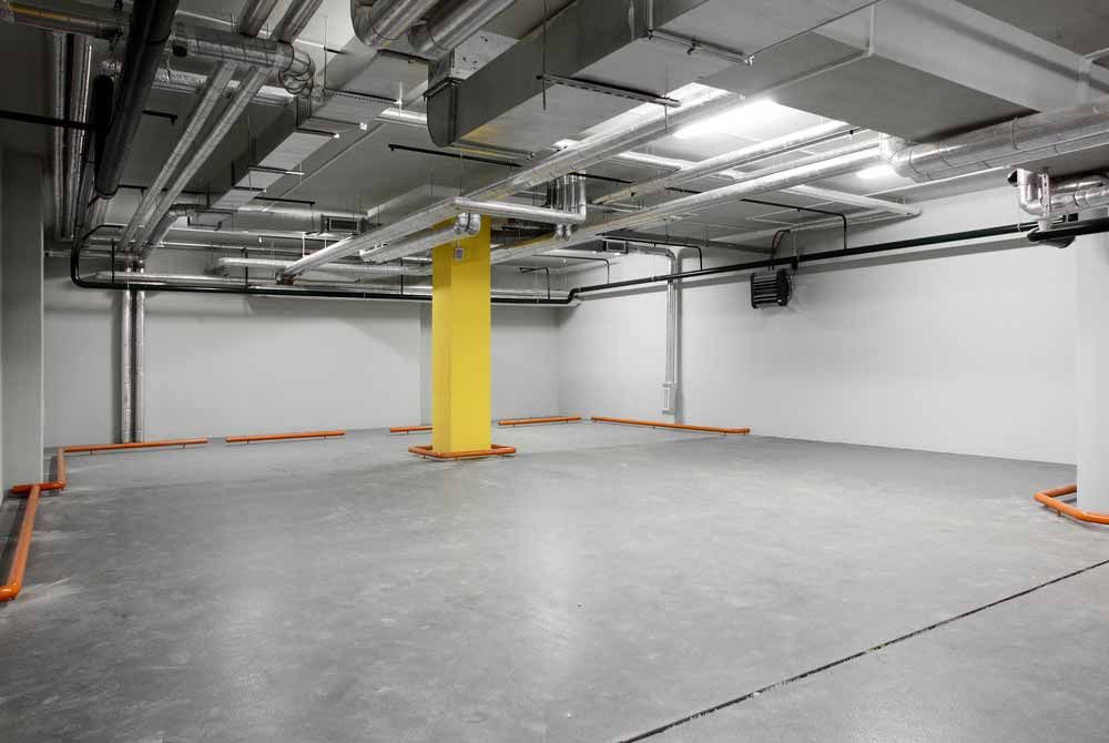 Empty Parking Garage, Concrete Floor, White Walls — Easy Mix Concrete In Wyong, NSW