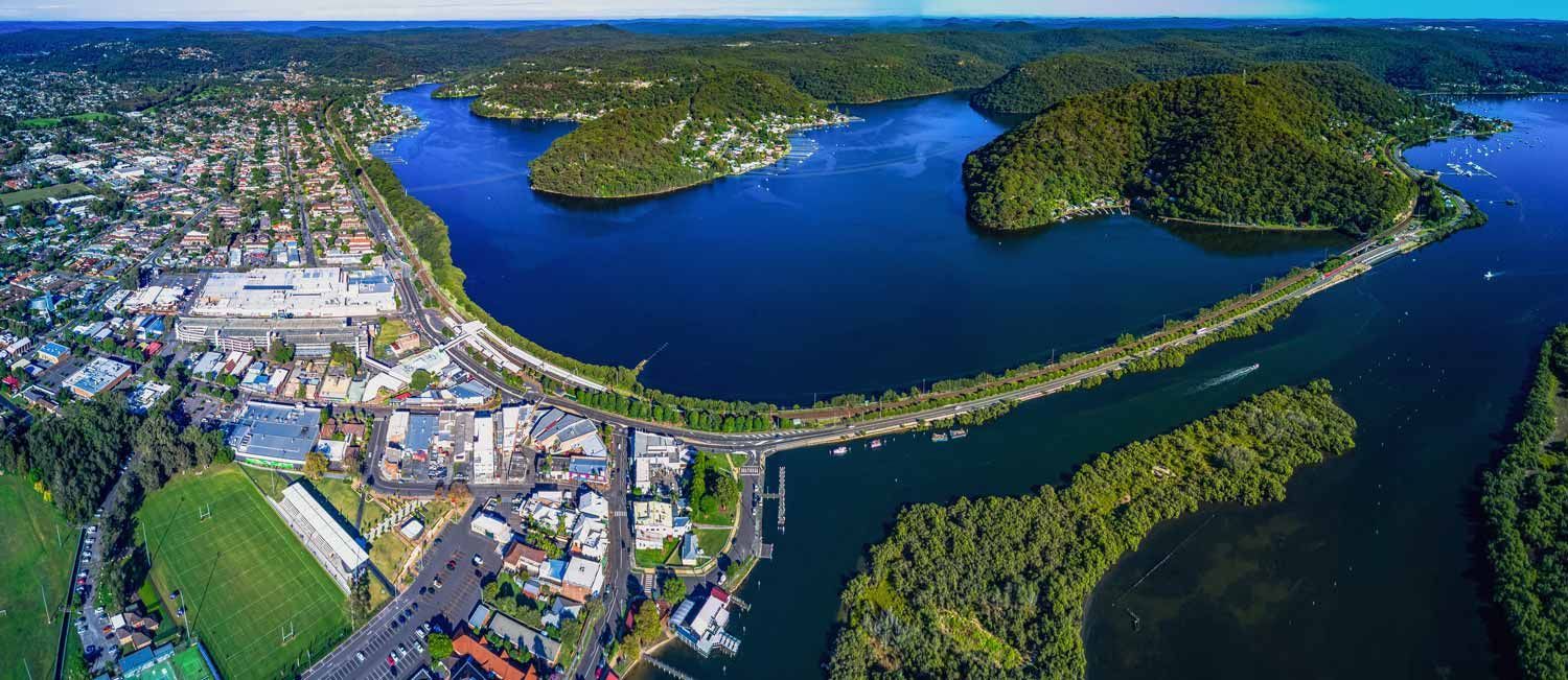 Aerial View of a Town on a Bay, Surrounded by Lush Green Hills — Easy Mix Concrete In Woy Woy, NSW