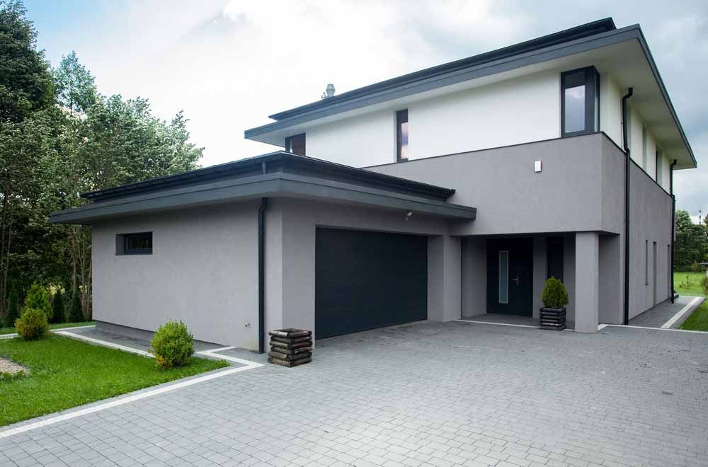 Modern Two-story House With Gray Garage Door — Easy Mix Concrete In Wyong, NSW