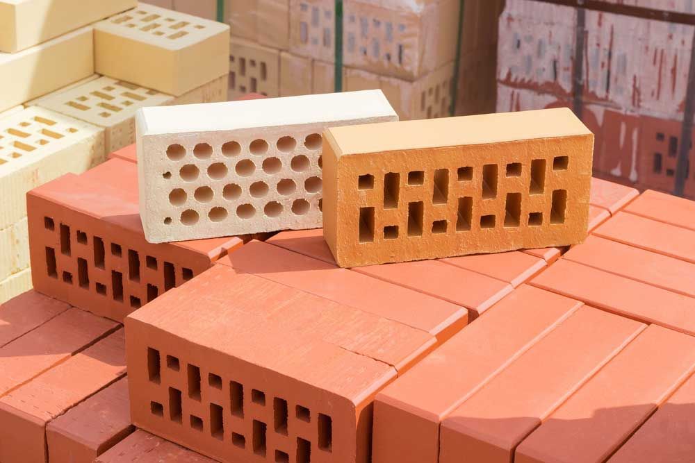 Red, Orange, and White Bricks With Varying Hole Patterns — Easy Mix Concrete In Charmhaven, NSW