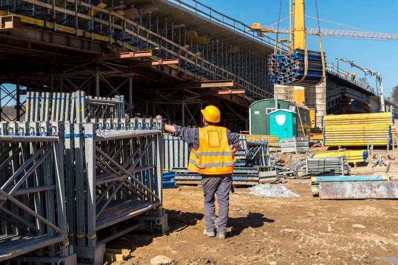 Construction Worker in Yellow Vest — Easy Mix Concrete In Charmhaven, NSW