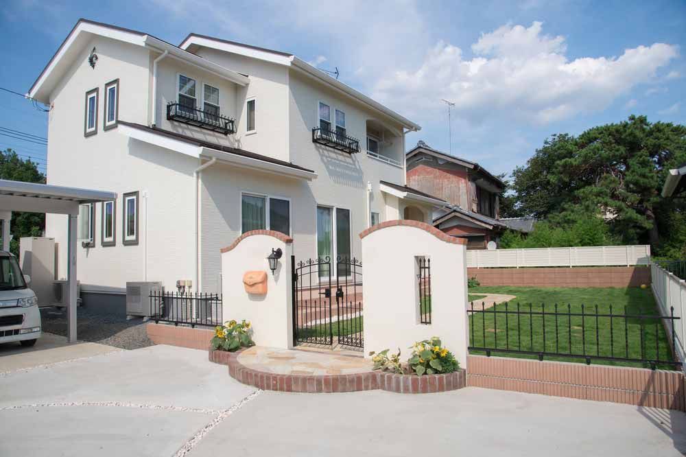 Two-story White House With a Carport and Small Yard — Easy Mix Concrete In Woy Woy, NSW