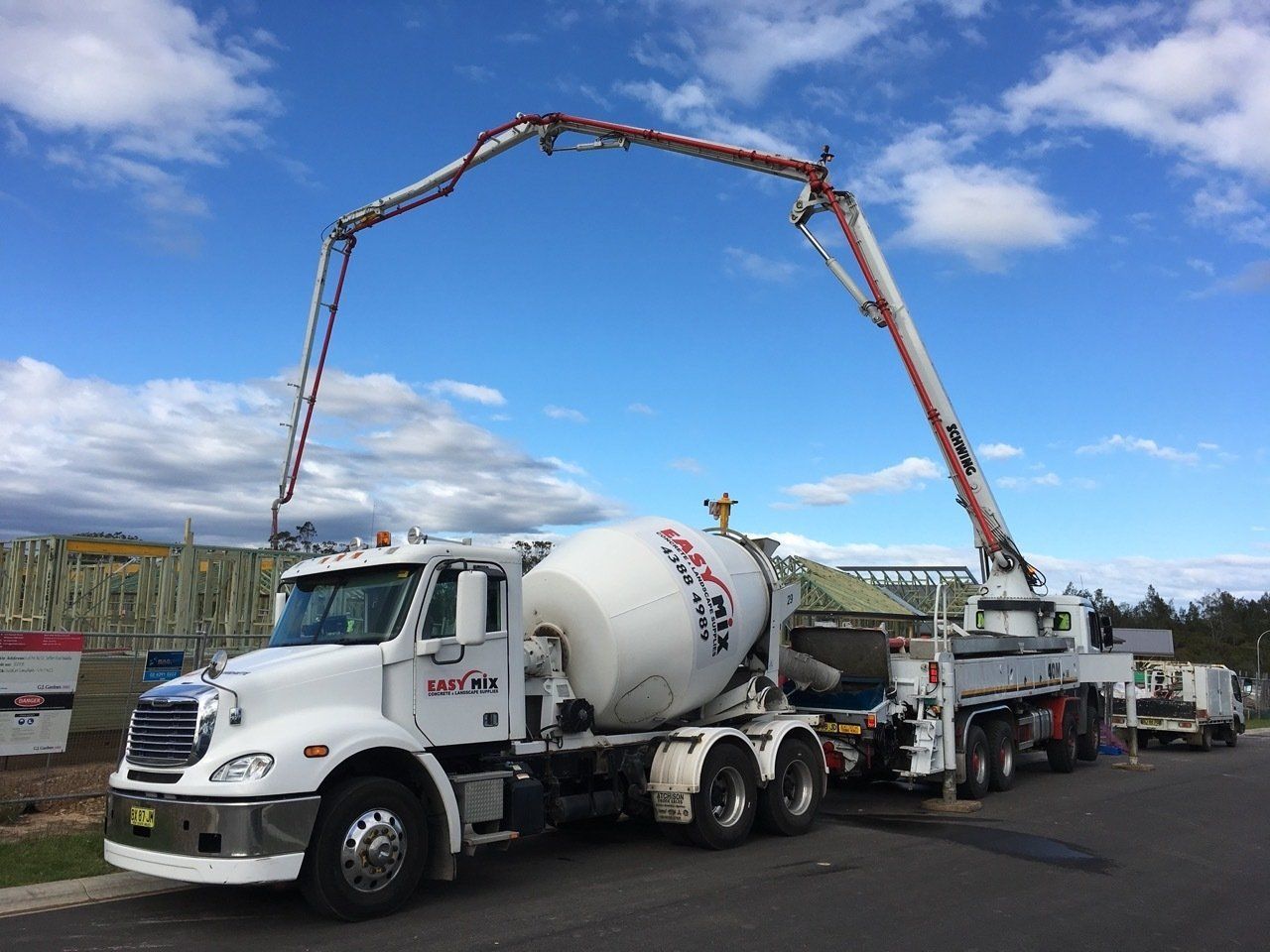Concrete Mixing Truck With an Extended Boom — Easy Mix Concrete in Berkeley Vale, NSW