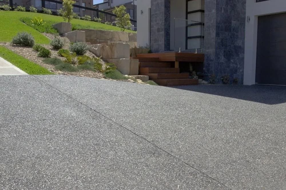Concrete Driveway Leading to a Modern House — Easy Mix Concrete In Berkeley Vale, NSW