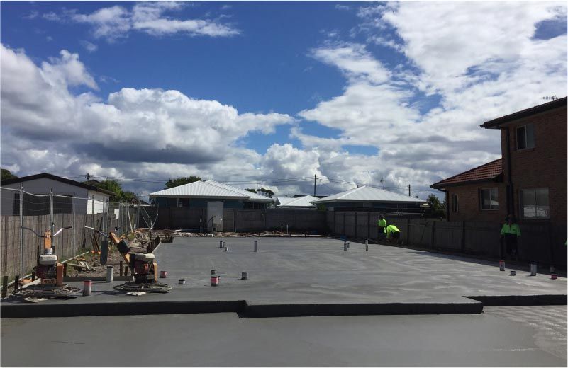 Newly Poured Concrete Slab in Residential Backyard — Easy Mix Concrete in Berkeley Vale, NSW
