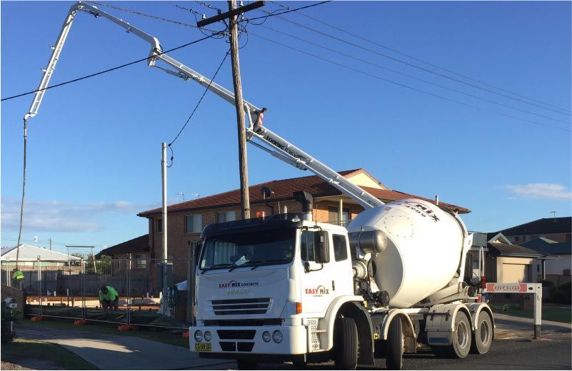 Concrete Mixer Truck Pouring Concrete — Easy Mix Concrete In Berkeley Vale, NSW