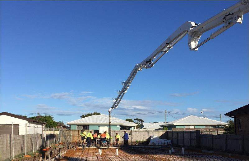 Concrete Pump Pouring Concrete on a Construction Site — Easy Mix Concrete in Berkeley Vale, NSW