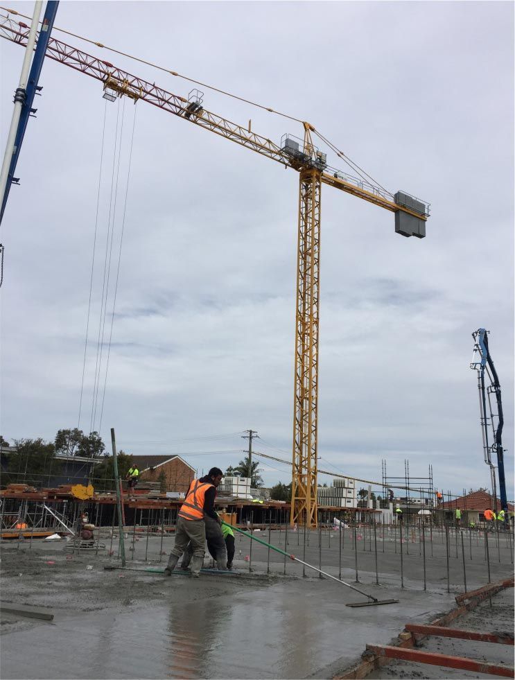 Construction Workers Leveling Wet Concrete — Easy Mix Concrete in Berkeley Vale, NSW