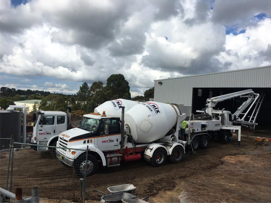Easy Mix Concrete Trucks Delivering Concrete — Easy Mix Concrete In Berkeley Vale, NSW