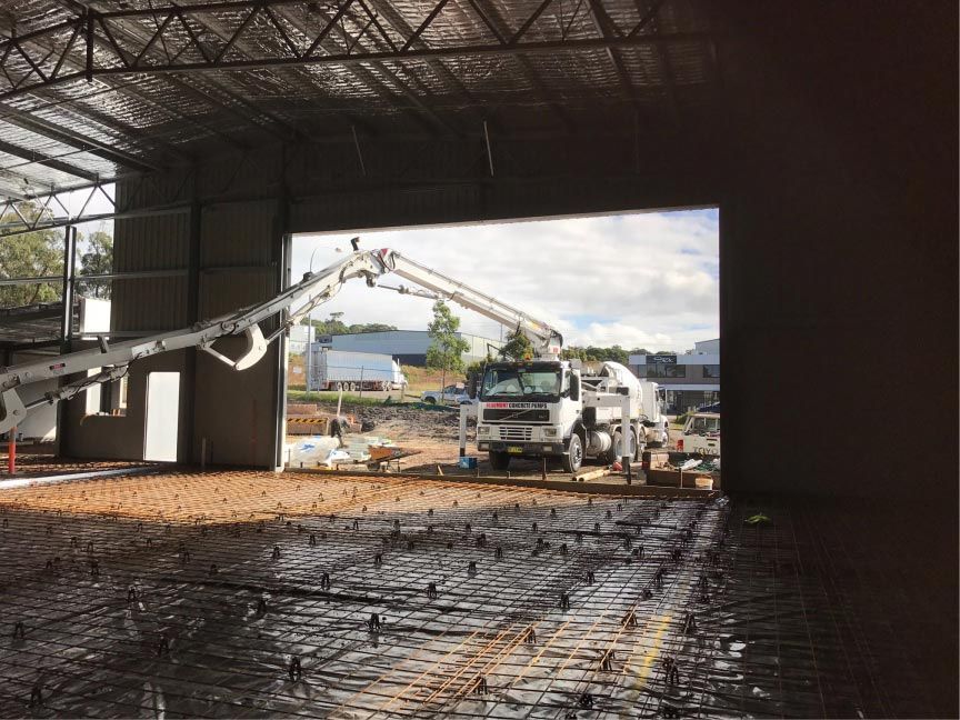 Concrete Pump Truck Pouring Concrete — Easy Mix Concrete in Berkeley Vale, NSW