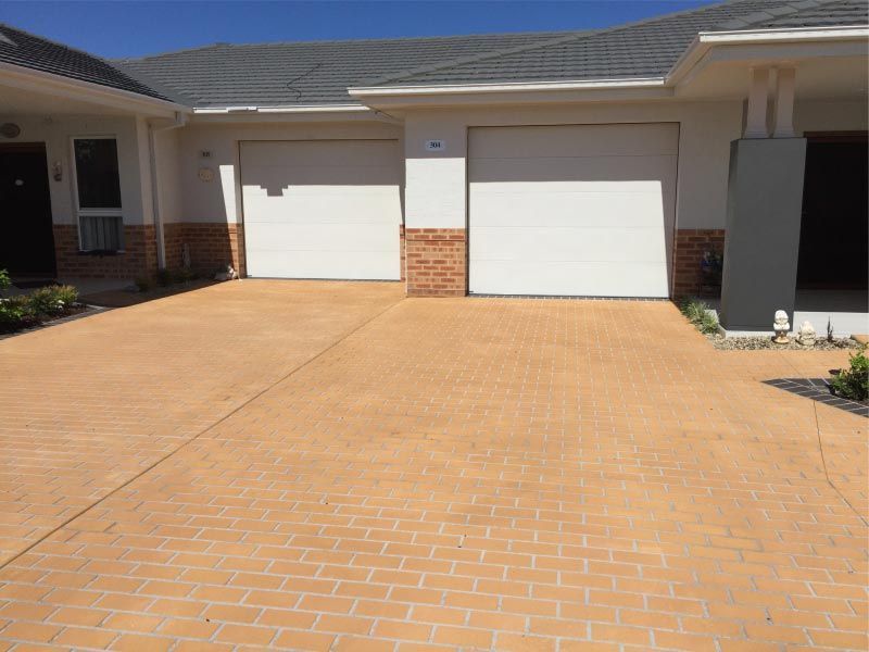 Brick-paved Driveway Leading to a House — Easy Mix Concrete in Berkeley Vale, NSW