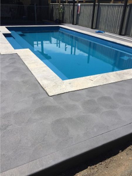 Pool With Blue Water and Gray Concrete Surrounding It — Easy Mix Concrete in Berkeley Vale, NSW