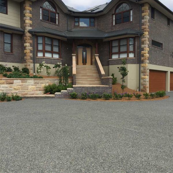 Brown Brick House With Stone Columns — Easy Mix Concrete in Berkeley Vale, NSW